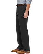 6'0, 180 lbs model in side angle wearing DexonMen classic - fit black wrinkle - free dress pants, no - iron all - season with hidden expandable waistband, size 32W×30L