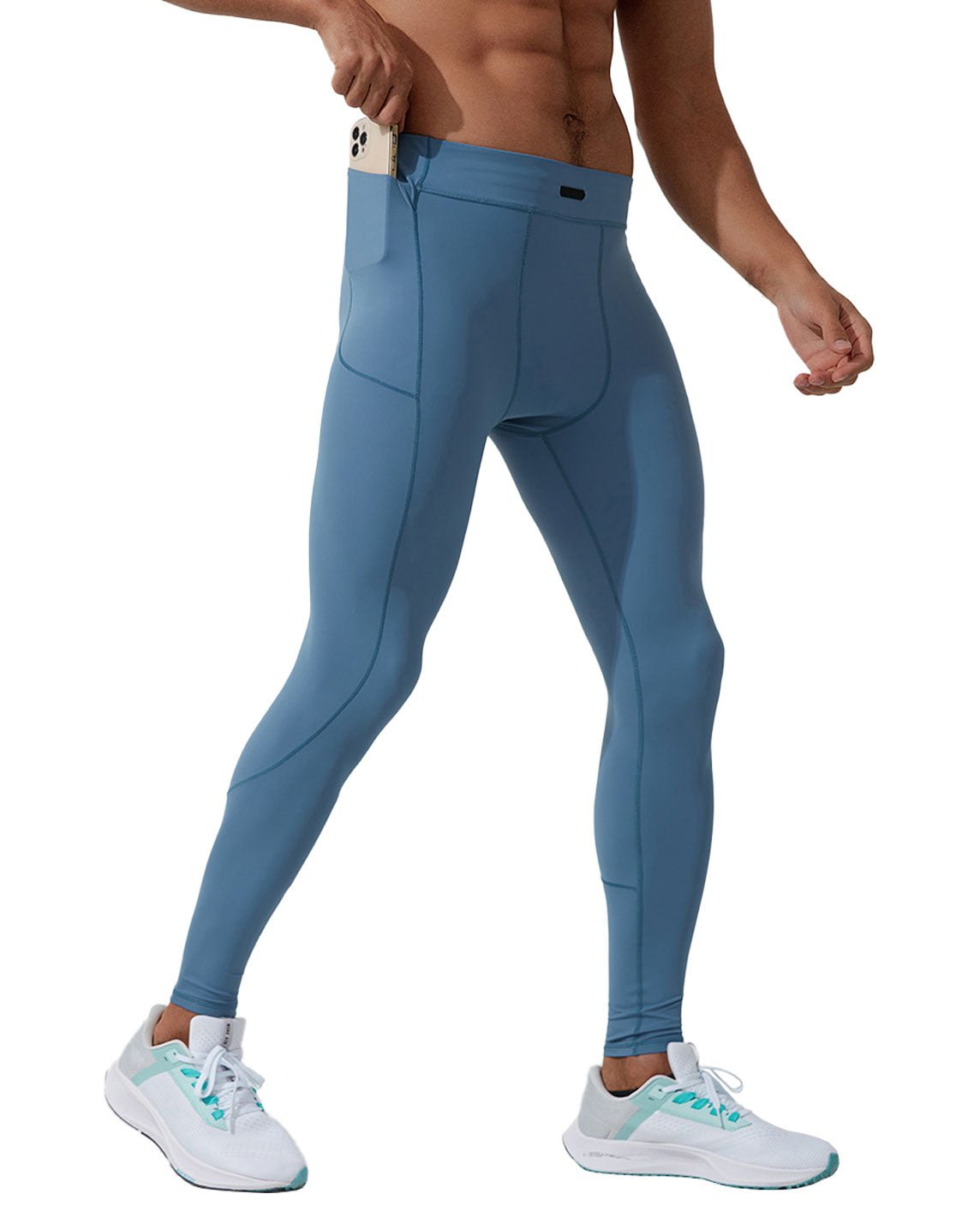 side view of a man wearing sky blue athletic leggings with side pockets