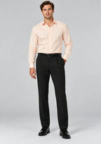 Man wearing Dexonmen men's black pleated dress pants with pink dress shirt, classic fit formal business office look