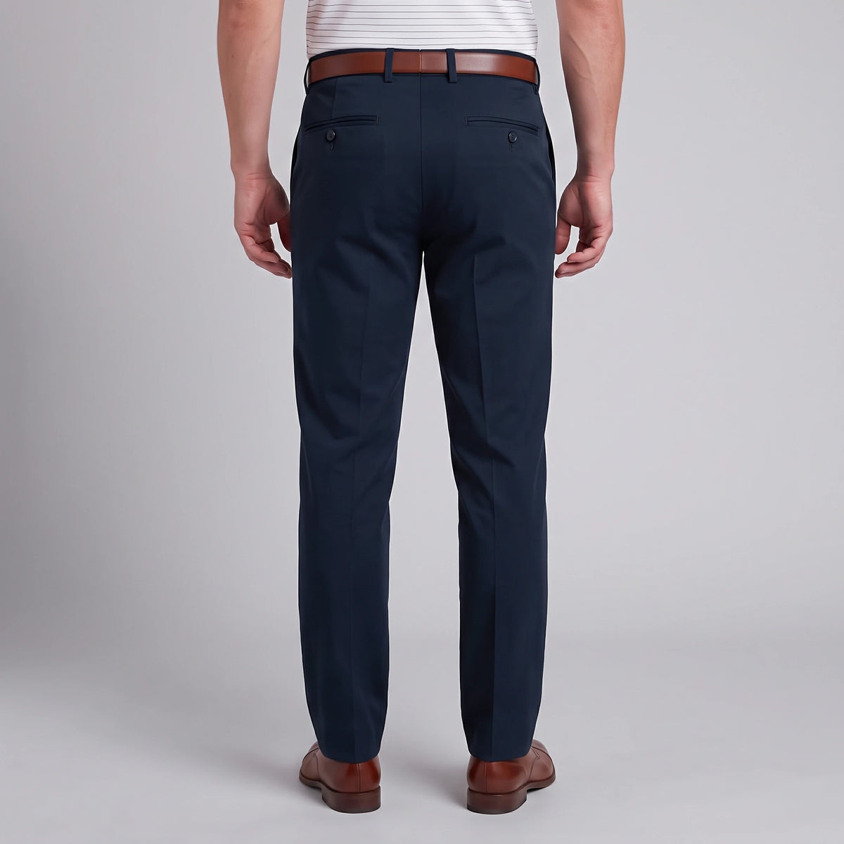 Back view of Dexonmen men's classic fit navy blue dress pants with buttoned back pockets