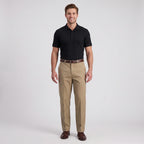 Man wearing khaki dress pants with black polo shirt and brown dress shoes, men's business casual outfit idea