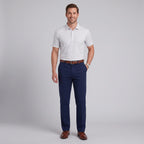 Man wearing Dexonmen men's navy blue dress pants with striped polo shirt, classic fit business casual outfit