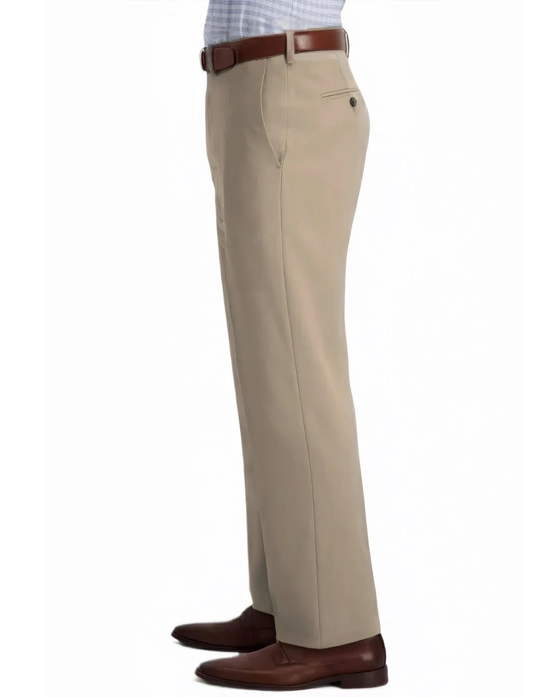 side view of a man wearing solid khaki dress pants with two side pockets