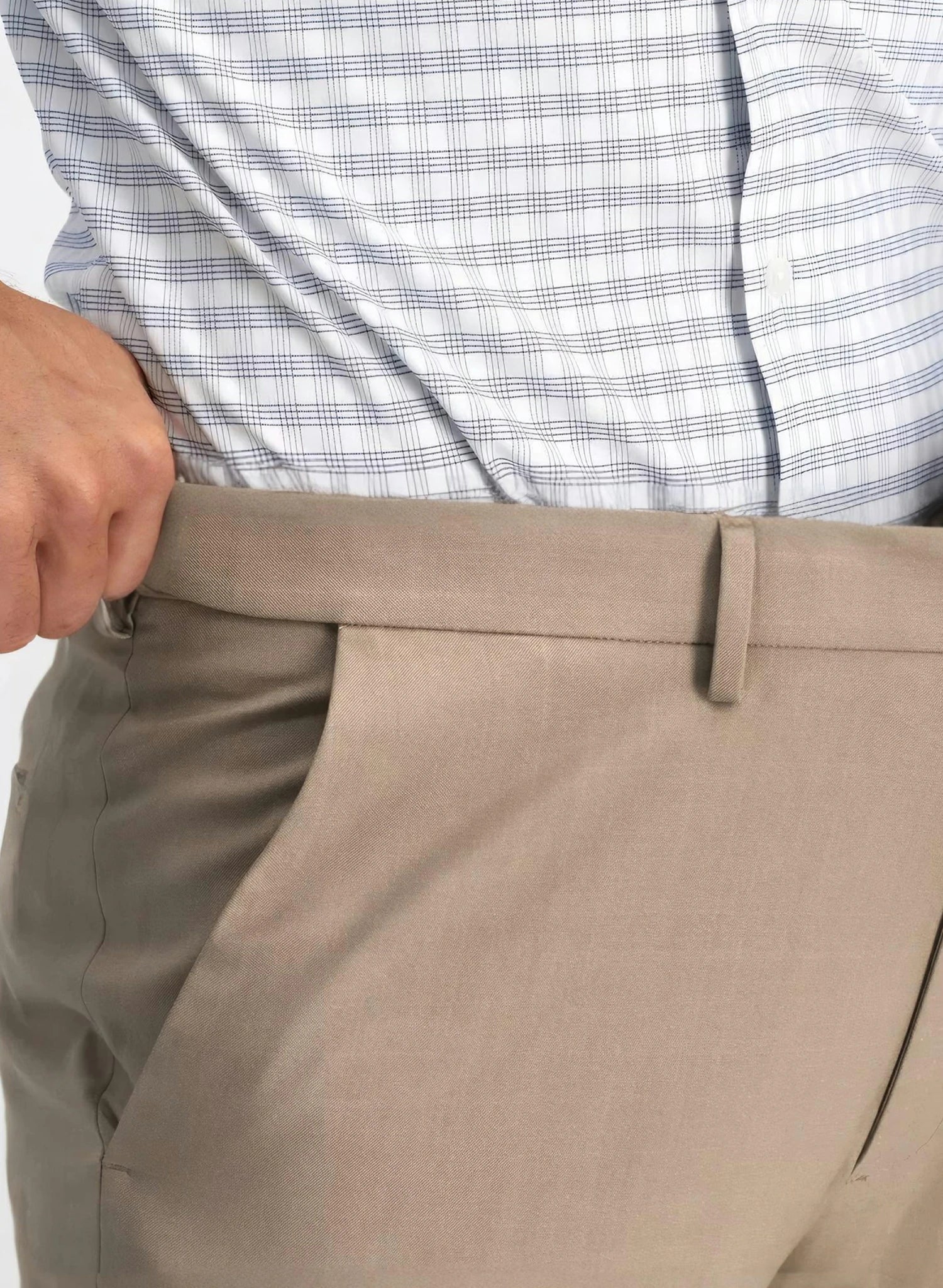 Close up view of a man wearing khaki straight leg classic dress pants expandable waistband