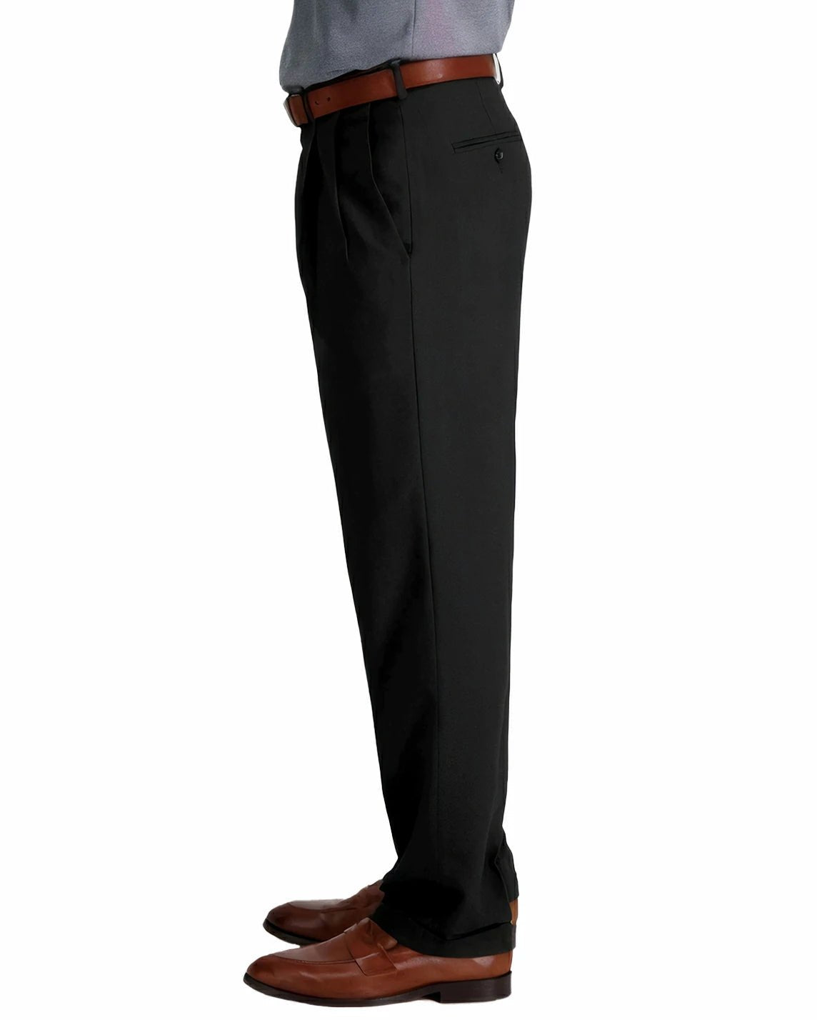 side view of a man wearing solid black pleated dress pants with two side pockets