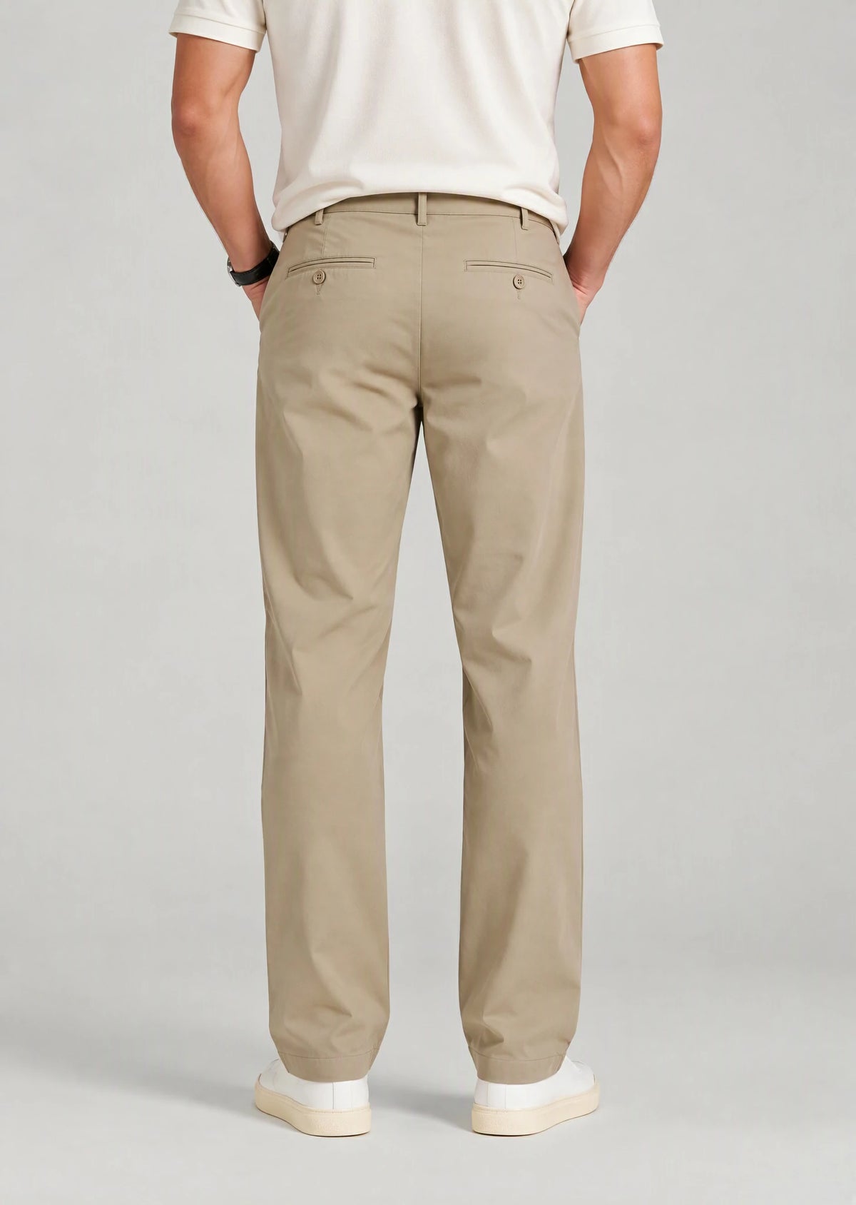 Back view of men's khaki dress pants with button welt pockets, classic relaxed fit chinos for office wear