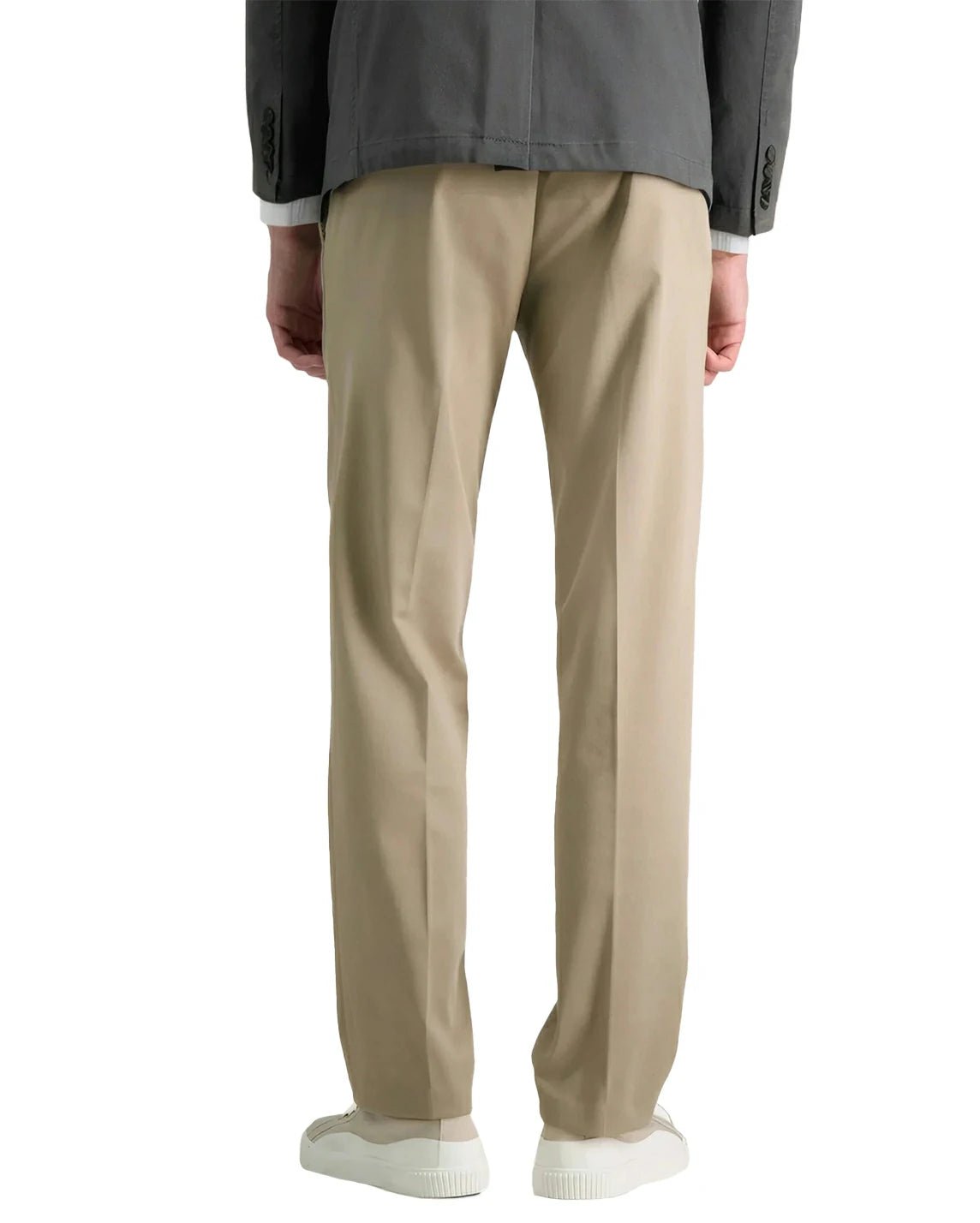 back view of a man in a khaki casual pants