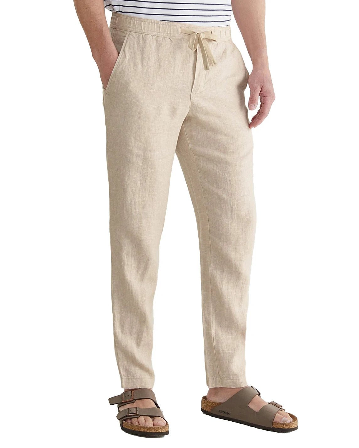 front view of a man wearing solid beige linen pants