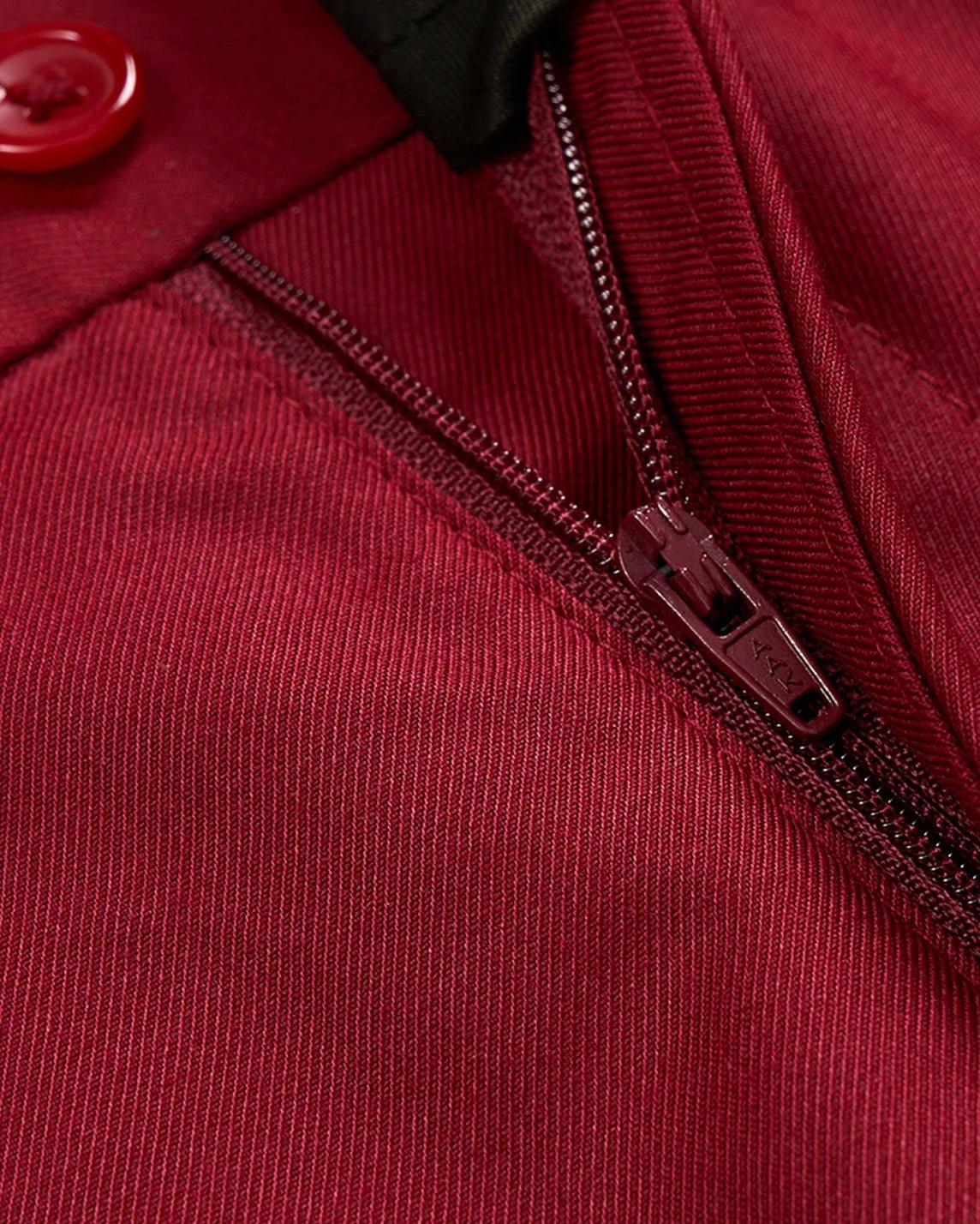 close-up of the zipper of men's red dress pants