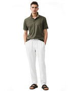 full front view of a man wearing solid white linen pants