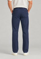 Back view of men's classic fit navy blue cotton pants with button welt back pockets, non-stretch casual trousers