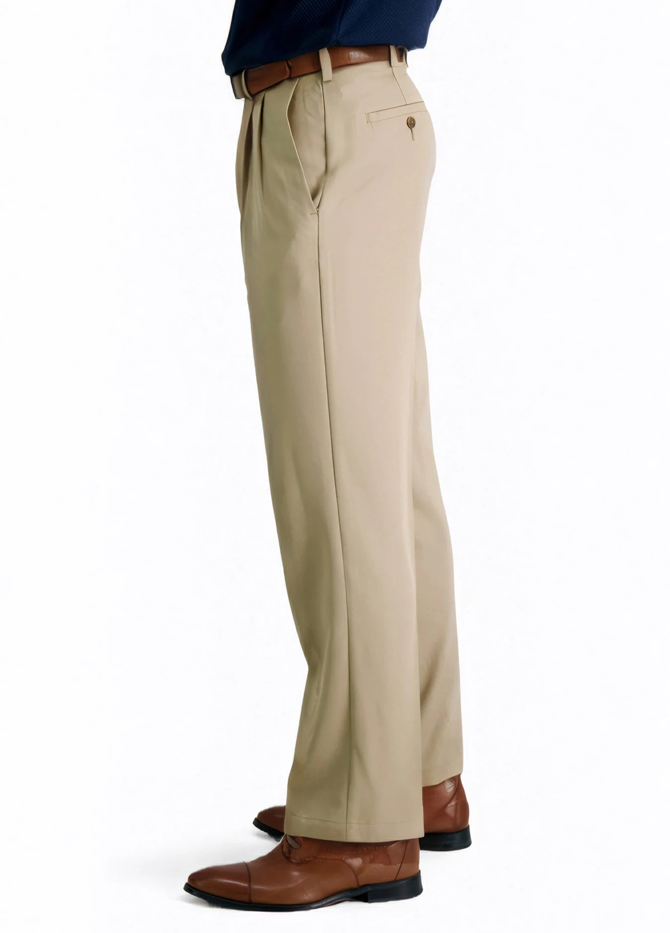 side view of a man wearing solid khaki pleated dress pants with two side pockets