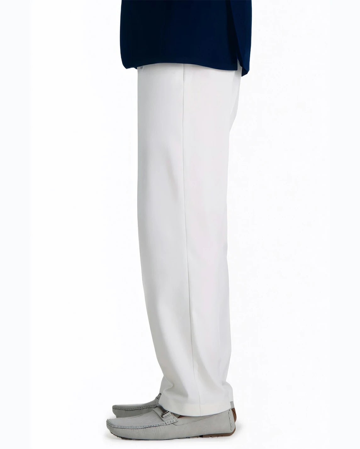 side view of a man wearing solid white dress pants with two side pockets